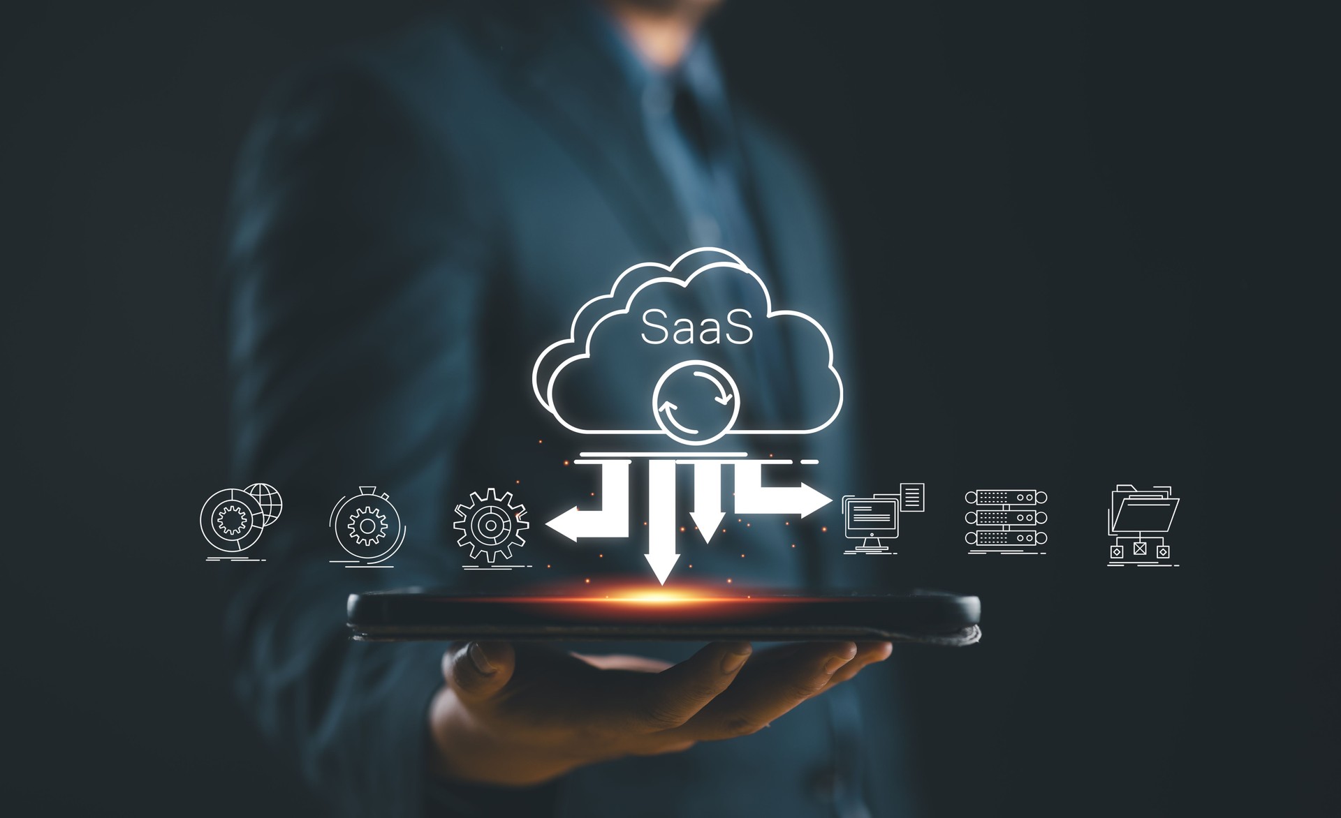 SaaS (software as a service) concept, Businessman show virtual screen of SaaS icons for software services on cloud system. Internet and networking technology.